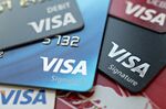 Visa Inc. debit and credit cards are arranged for a photograph in Washington, D.C., U.S., on Friday, Oct. 20, 2017.