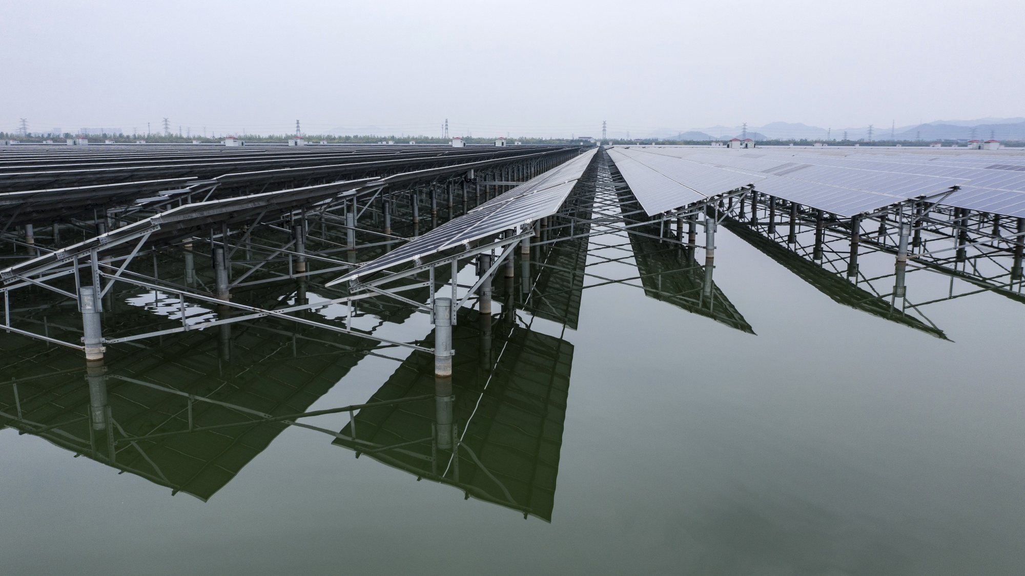 Photovoltaic panels stand in a floating solar farm on the outskirts of Ningbo, Zhejiang Province, China.
