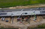 Contractors work on a portion of Highway 101 under construction in Petaluma, California.