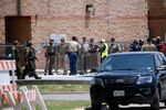 Law enforcement personnel gather outside Robb Elementary School following a shooting Tuesday in Uvalde, Texas.&nbsp;