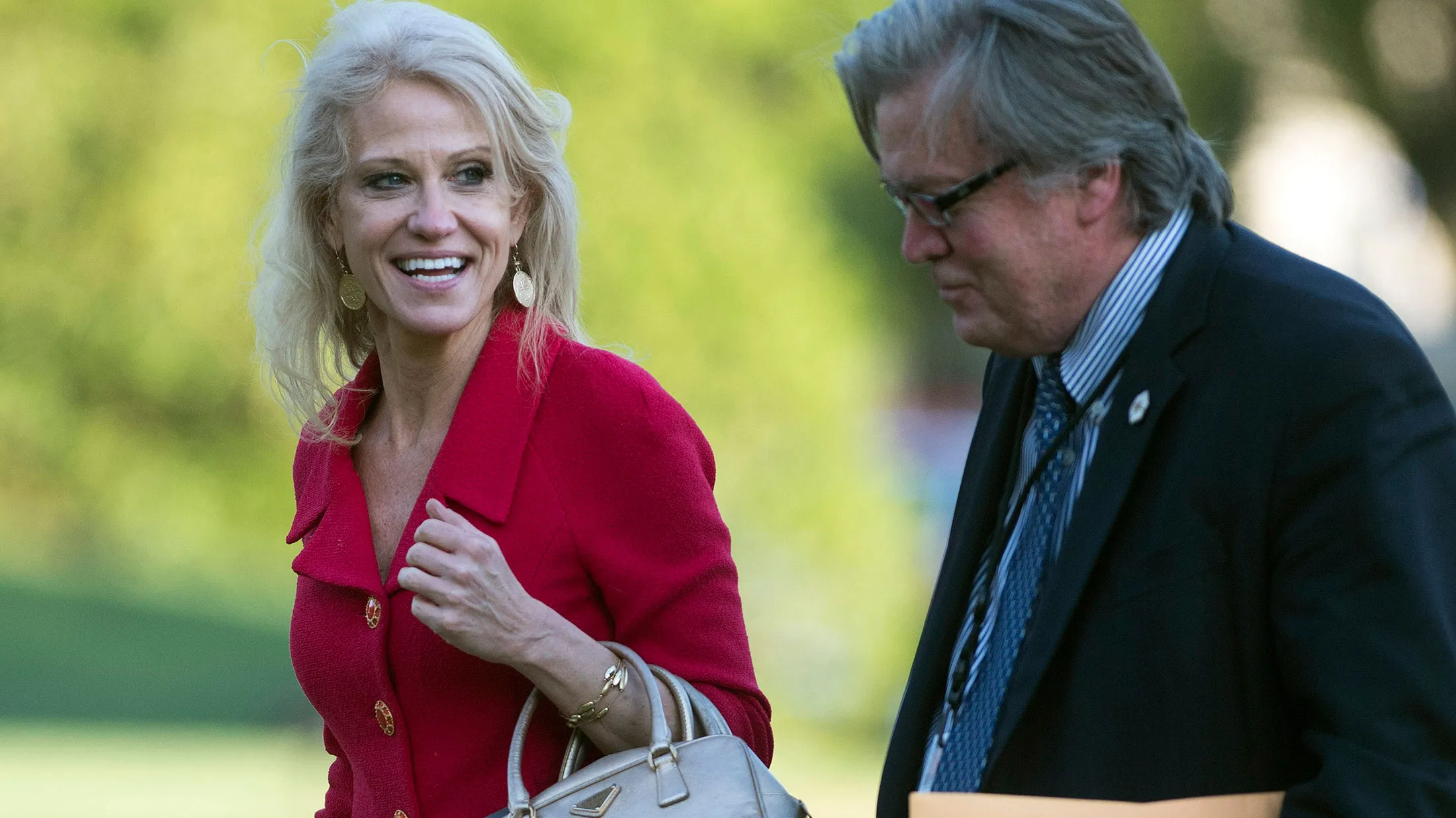 Kellyanne Conway and Stephen Bannon return to the White House on April 18, 2017, in Washington.
