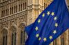 An European Union (EU) flag flies near the Houses of Parliament in London.