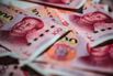 Chinese Yuan Banknotes As China Rolls Over Policy Loans With Party Congress Underway