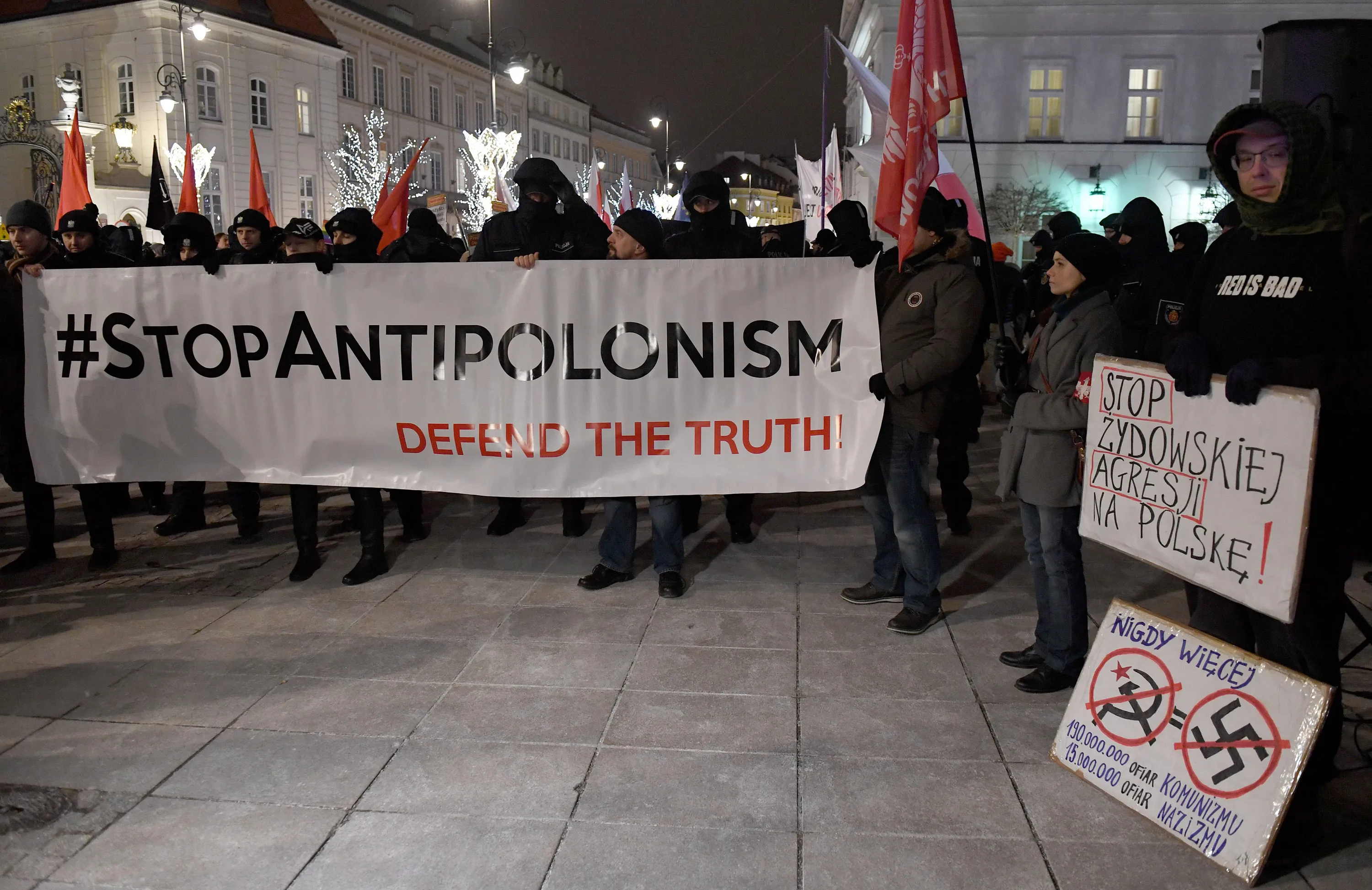 Far-right protesters hold a banner during a demonstration to support the law.