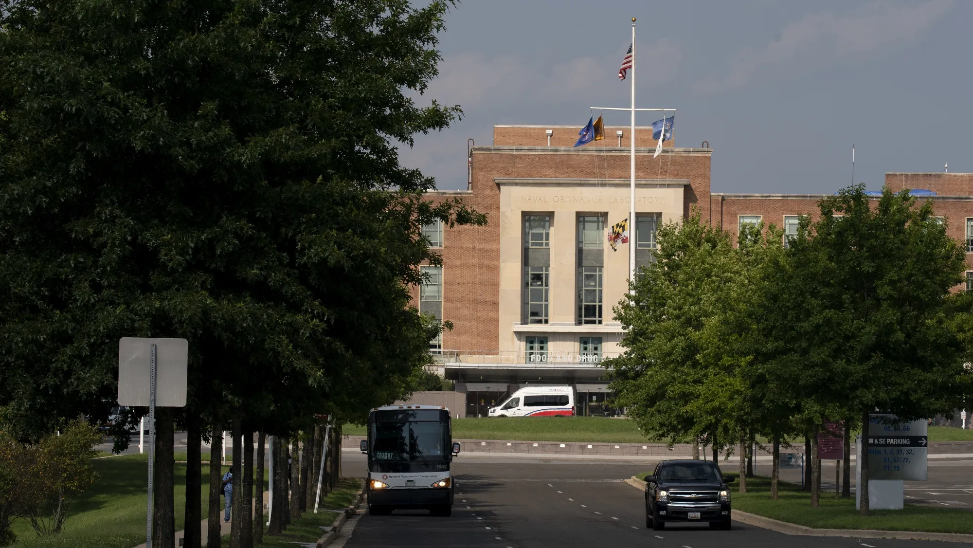 Vehicles drive in front of the U.S. Food and Drug Administration headquarters in White Oak, Maryland.