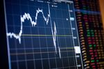A monitor displays an S&P 500 chart on the floor of the New York Stock Exchange.