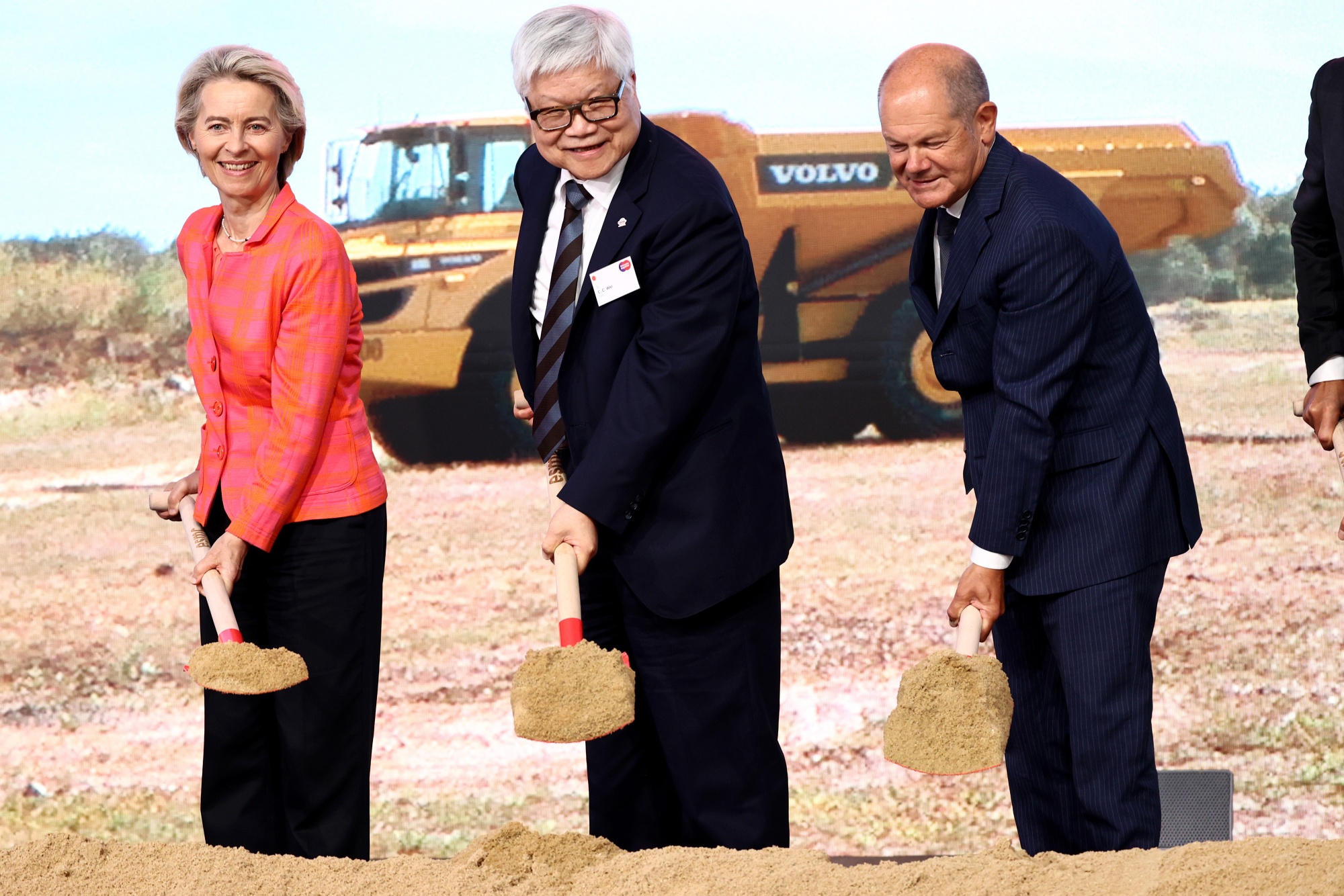 Ursula von der Leyen, president of the European Commission, left, C.C. Wei, chief executive officer of Taiwan Semiconductor Manufacturing Co., center, and Olaf Scholz, Germany's chancellor, pose for photos at the ground-breaking ceremony for the new European Semiconductor Manufacturing Co. (ESMC) plant in Dresden, Germany, on Tuesday, Aug. 20, 2024. The European Union approved a €5 billion ($5.5 billion) German subsidy for TSMC's plan to built a chip plant in eastern Germany in partnership with Infineon Technologies AG, NXP Semiconductors NV and Robert Bosch GmbH. Photographer: Liesa Johannssen/Bloomberg