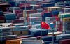 A Chinese flag is seen in front of containers at the Yangshan Deep-Water Port, an automated cargo wharf, in Shanghai on April 9, 2018. - China warned that trade talks with the United States were "impossible" under current conditions after President Donald Trump reassured markets by suggesting that the dispute could be resolved. (Photo by Johannes EISELE / AFP) (Photo credit should read JOHANNES EISELE/AFP/Getty Images)