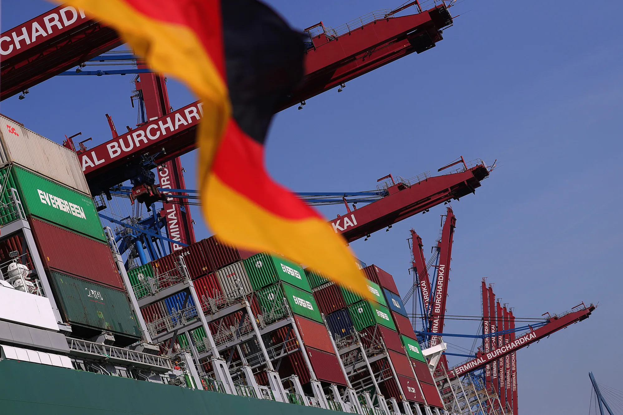 Shipping containers sit on board a cargo ship in the Port of Hamburg.