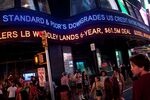 An ABC News ticker in Times Square announces a U.S. credit downgrade on Aug. 5, 2011.