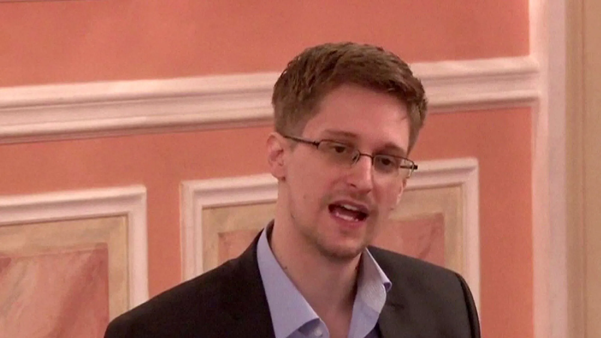 A frame grab made from AFPTV footage, reportedly taken on October 9, 2013, shows US intelligence leaker Edward Snowden speaking during his dinner with a group of four retired US ex-intelligence workers and activists at a luxurious room in an unidentified location.
