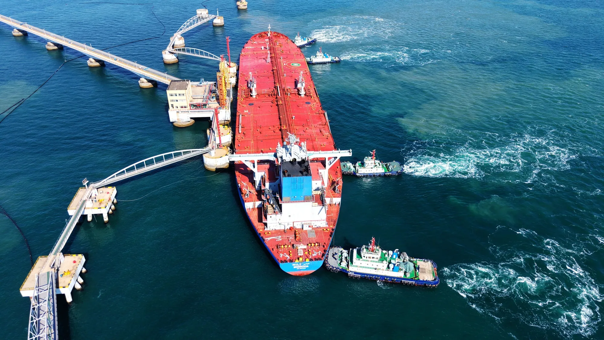 A cargo ship loaded with imported crude oil docks at the crude oil terminal berth in Qingdao, Shandong Province.