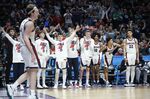 Players on the Gonzaga bench cheer for Gonzaga forward Drew Timme, left, during the second half of a first round NCAA college basketball tournament game against Georgia State, Thursday, March 17, 2022, in Portland, Ore. (AP Photo/Craig Mitchelldyer)