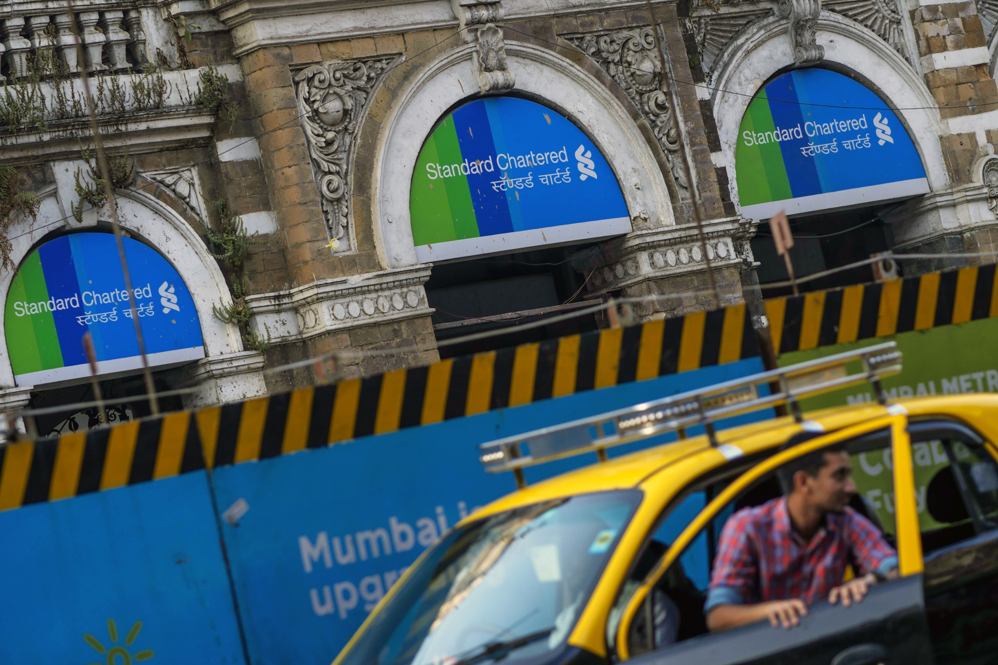A Standard Chartered Plc. bank branch stands in Mumbai, India.