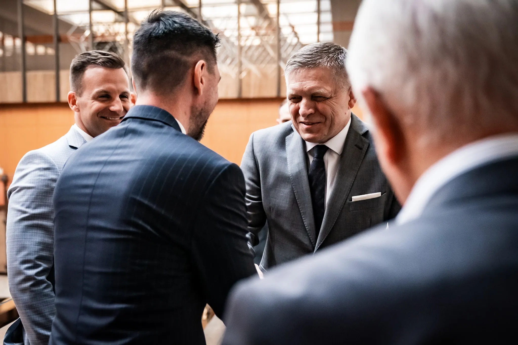 Robert Fico, second right, speaks to colleagues in Bratislava on July 9.