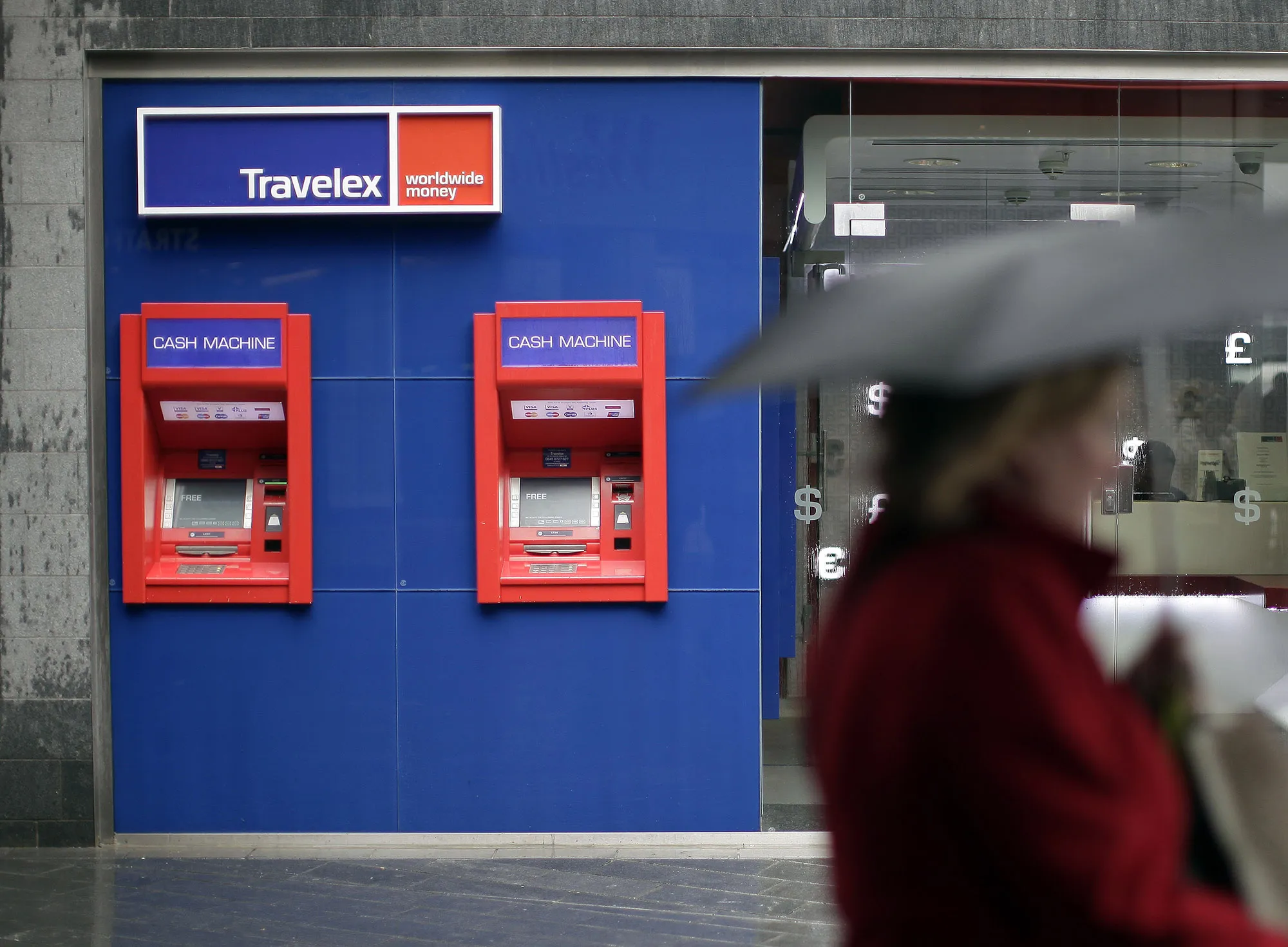 A pedestrian passes a Travelex store in London.
