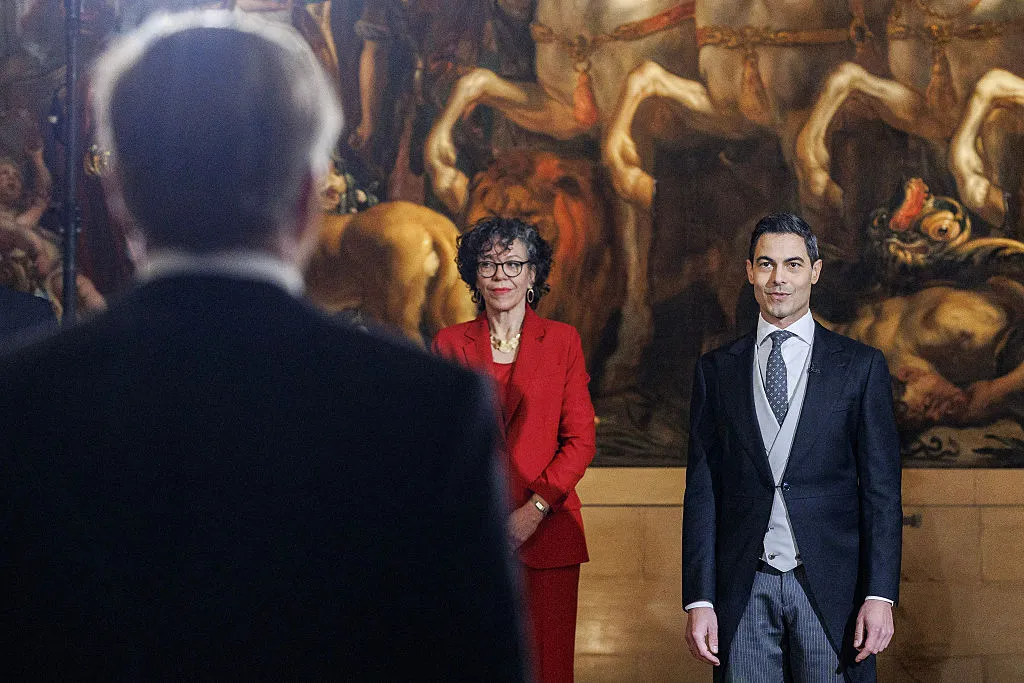 Heleen Herbert and Rob Jetten stand in front of Willem-Alexander during the swearing-in ceremony in The Hague, on Feb.&nbsp;23.