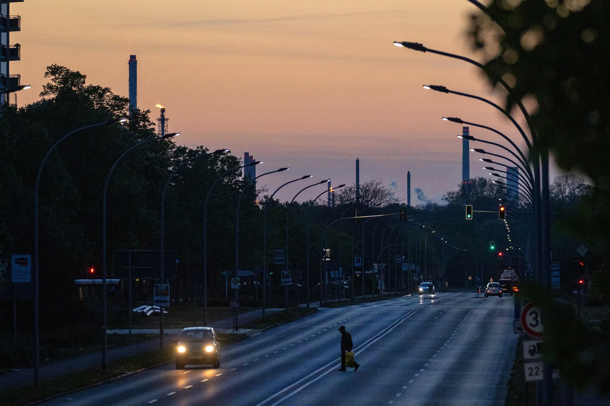 Flare and chimney stacks at the PCK Schwedt oil refinery on the horizon in Schwedt, Germany.
