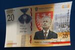 A large banner commemorating a new 20 Zloty banknote, featuring late politician Lech Kaczynski, outside Poland's Central Bank, also known as Narodowy Bank Polski, in Warsaw, Poland, on Thursday, Nov. 25, 2021.