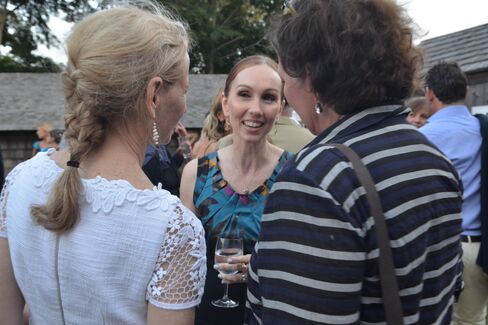 Andrea Grover, center, chats with Guild Hall gala guests.