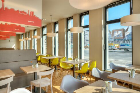 The breakfast room of the Meininger Hotel in Frankfurt/Main. Photographer: Wolfgang Scholvien/Meininger Hotels via Bloomberg