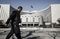 A man walks past the People's Bank of China (PBOC) headquarters in Beijing, China, on Thursday, March 9, 2017. China's central bank plans to apply a stricter method for assessing banks' capital as part of efforts to contain financial-sector risks, people with knowledge of the matter said. Photographer: Qilai Shen/Bloomberg