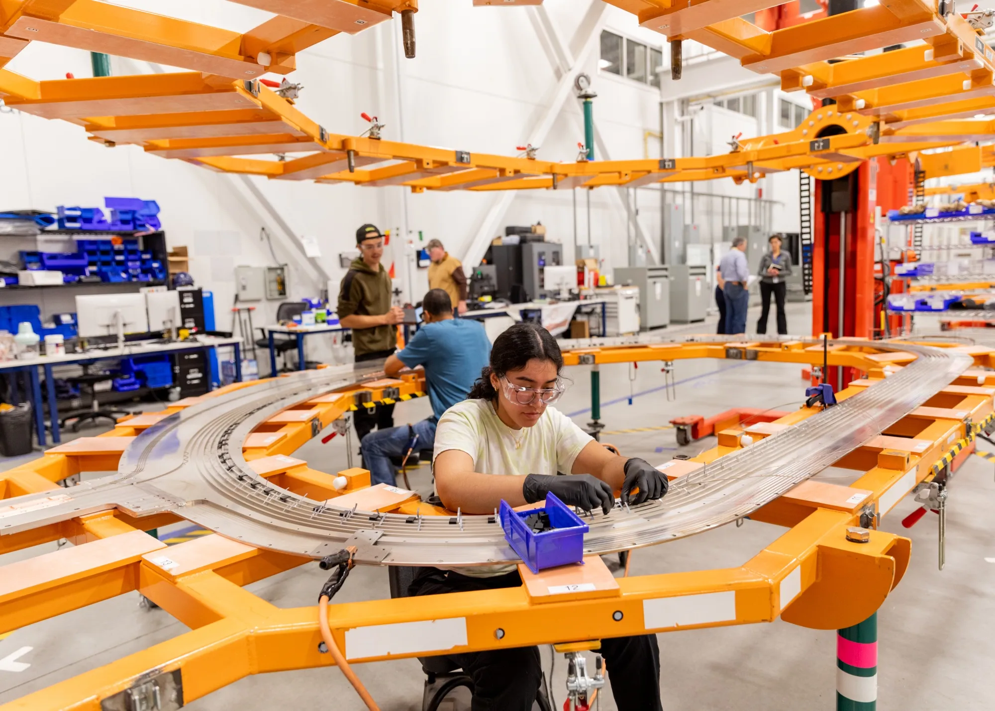 Workers assemble toroidal field magnets at the Commonwealth Fusion Systems campus in Massachusetts, US.