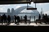 People wait for a train at Circular Quay near the harbour in Sydney on July 5, 2016. Australia\'s central bank on July 5 held interest rates steady at an all-time low of 1.75 percent, with uncertainty about the Brexit impact and inflation outlook making it \"prudent\" to stay on hold. / AFP / PETER PARKS (Photo credit should read PETER PARKS/AFP/Getty Images)