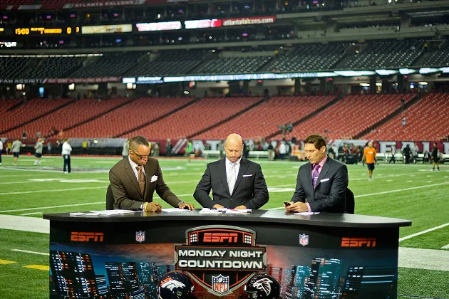 ESPN anchors Stuart Scott, Trent Dilfer and Steve Young, from left, on Sept. 17, 2012, in Atlanta