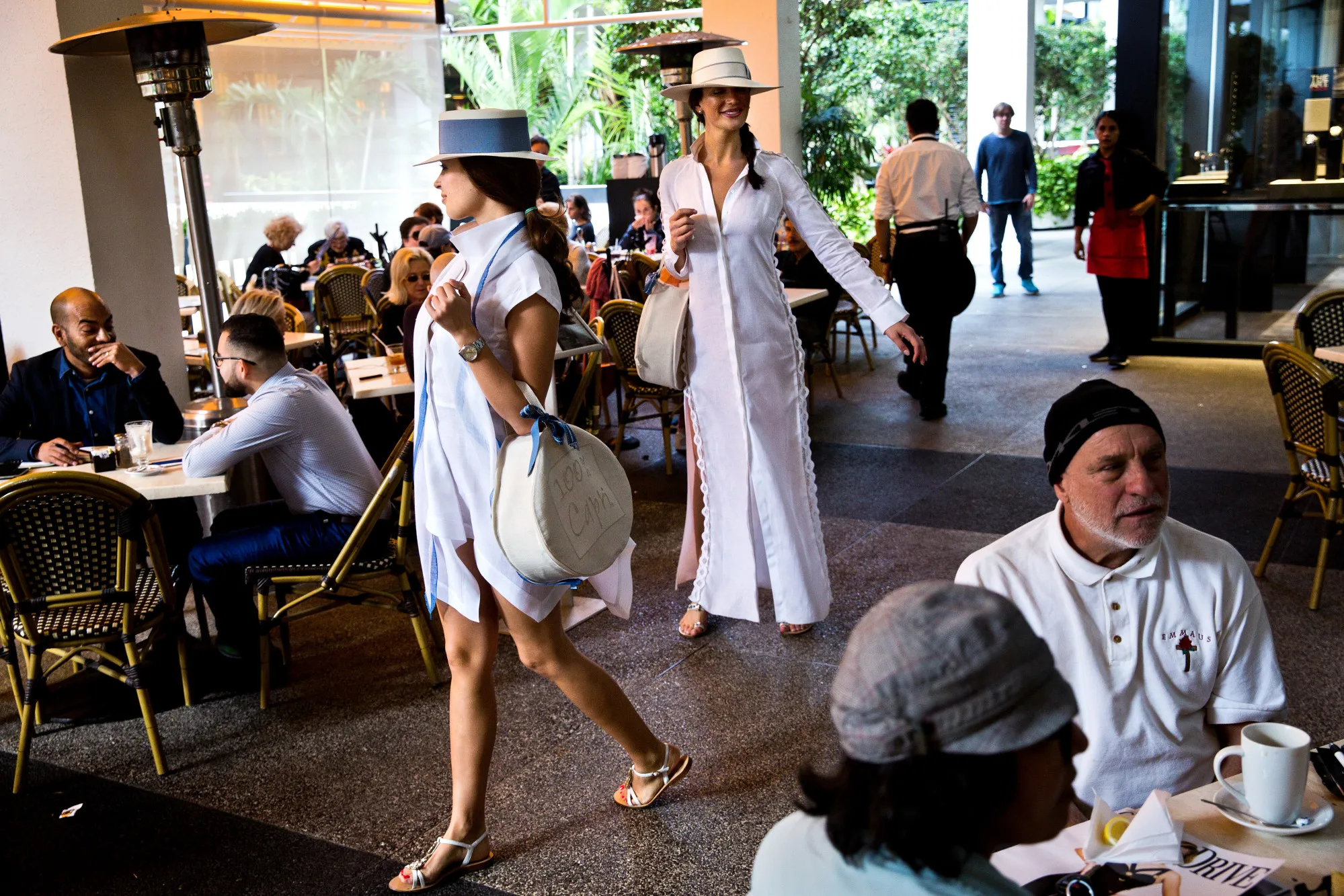 Models from 100% Capri walk through the Bal Harbour Shops in Miami,&nbsp;advertising the store’s clothing.
