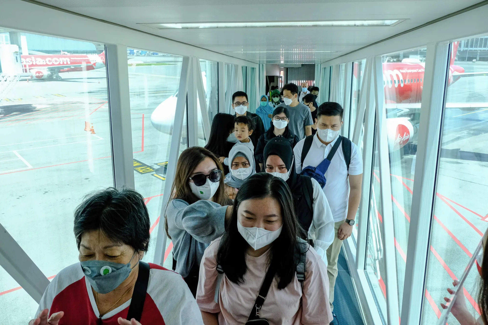 Passengers disembark an AirAsia flight at Kuala Lumpur International Airport 2 (KLIA 2) in Sepang, Malaysia, earlier in April.