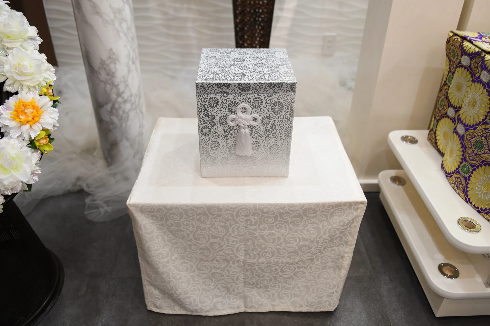 A cinerary urn displayed inside a funeral service room at Tear Corp.'s branch in Noda, Japan.