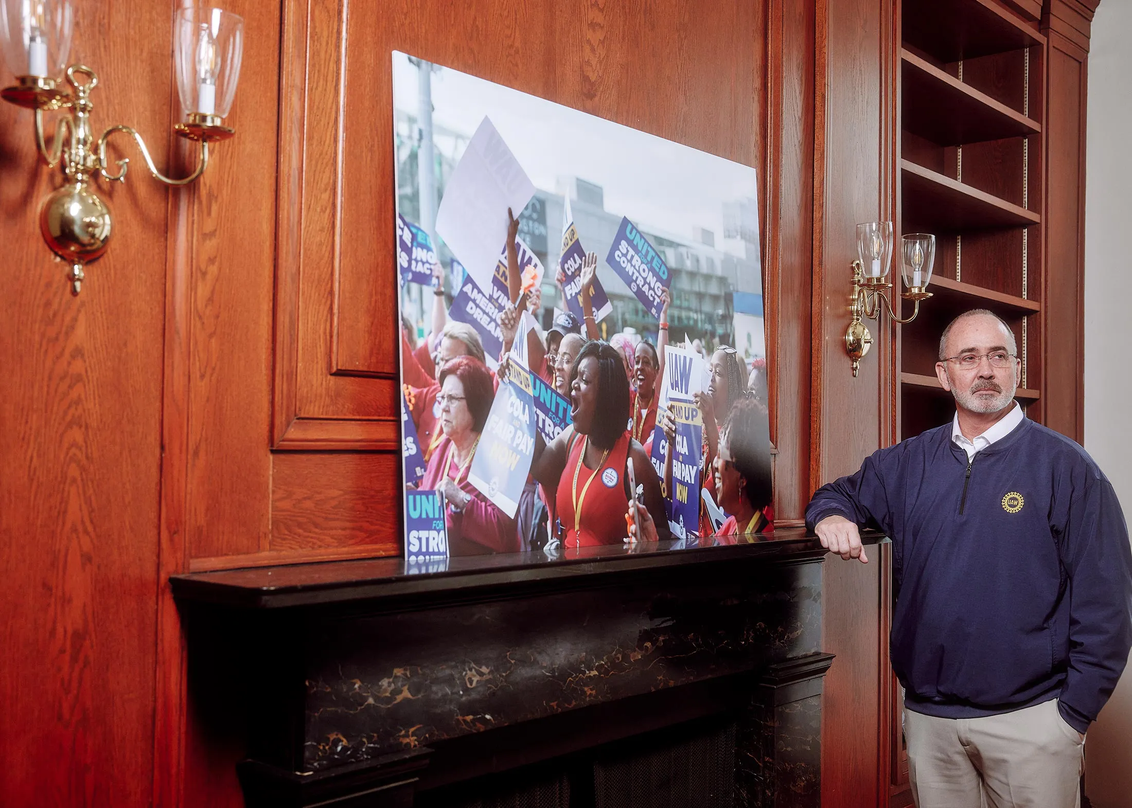 Fain in the union’s Washington office with a photo from a recent rally.