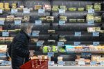 A customer shops in the prepared food section of the Trader Joe's Upper East Side Bridgemarket grocery store in New York, U.S., on Thursday, Dec. 2, 2021.