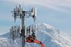 A contract crew for Verizon works on a cell tower to update it to handle the new 5G network in Orem, Utah, on Dec. 10, 2019.