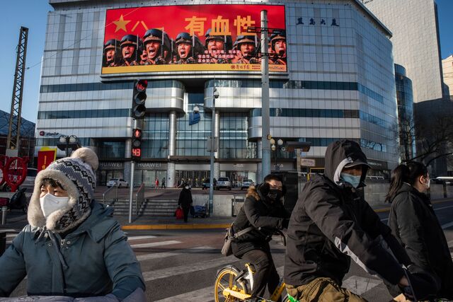 Pedestrians and cyclists on the street of Chaoyang district in Beijing, China, on Friday, Dec. 30, 2022.