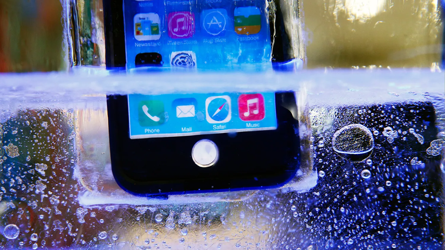 A LifeProof Fre waterproof case for the Apple Inc. iPhone 6 case is submerged in water and ice during the 2015 Consumer Electronics Show (CES) in Las Vegas, Nevada, U.S., on Wednesday, Jan. 7, 2015.

