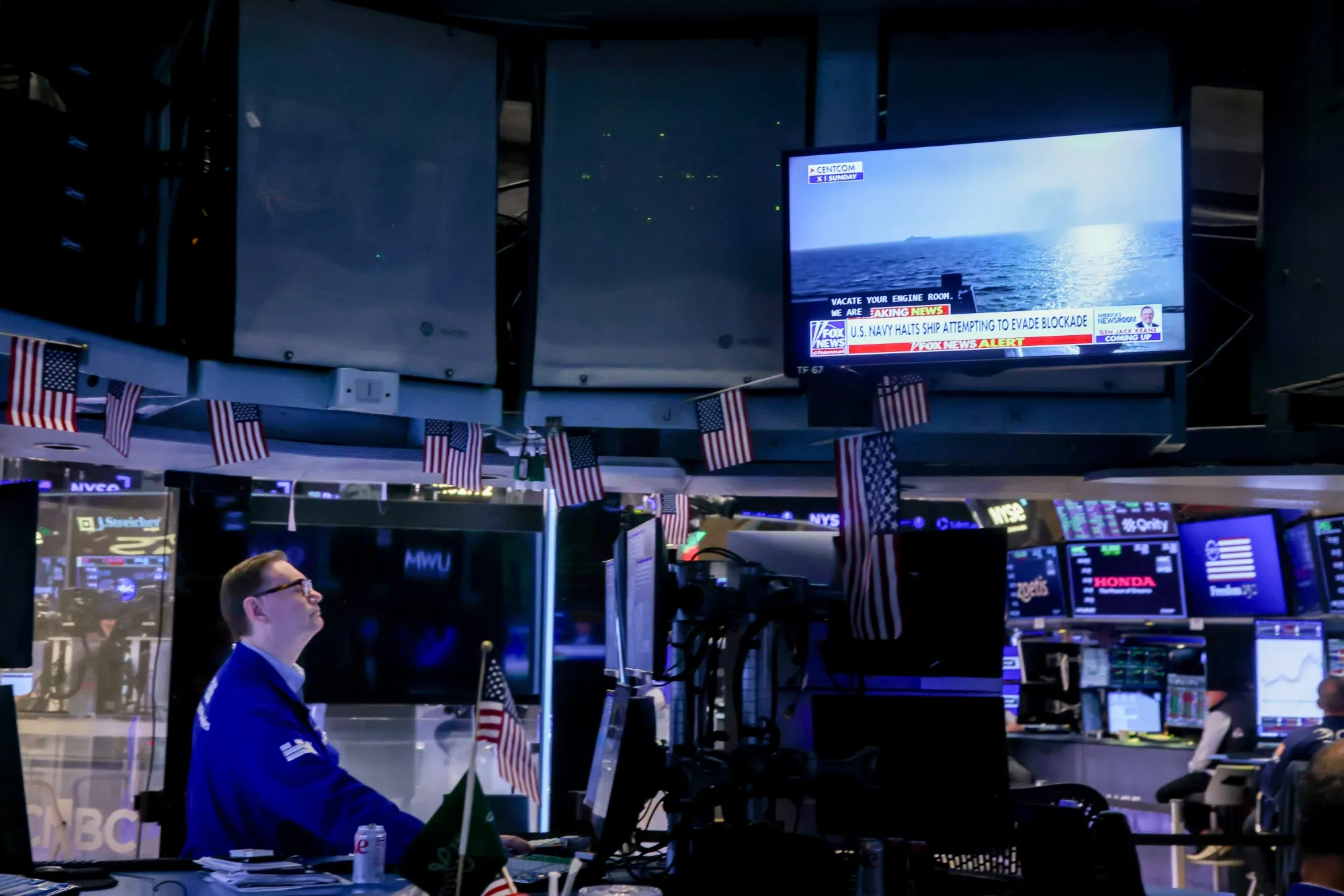 A television broadcasts Iran war news on the floor of the New York Stock Exchange.