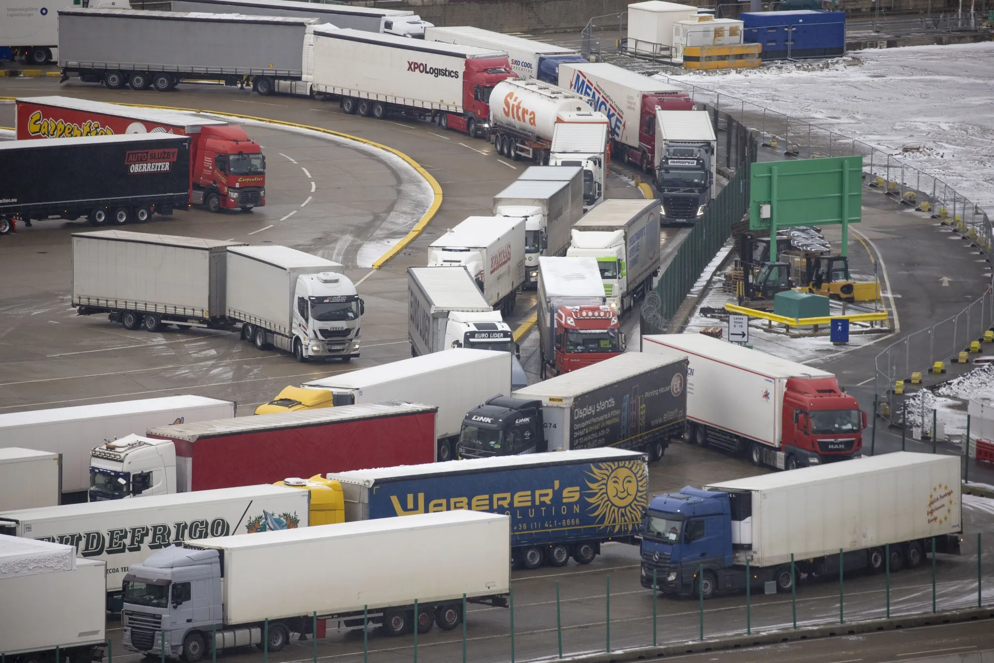 Trucks queue to board a ferry at the Port of Dove.