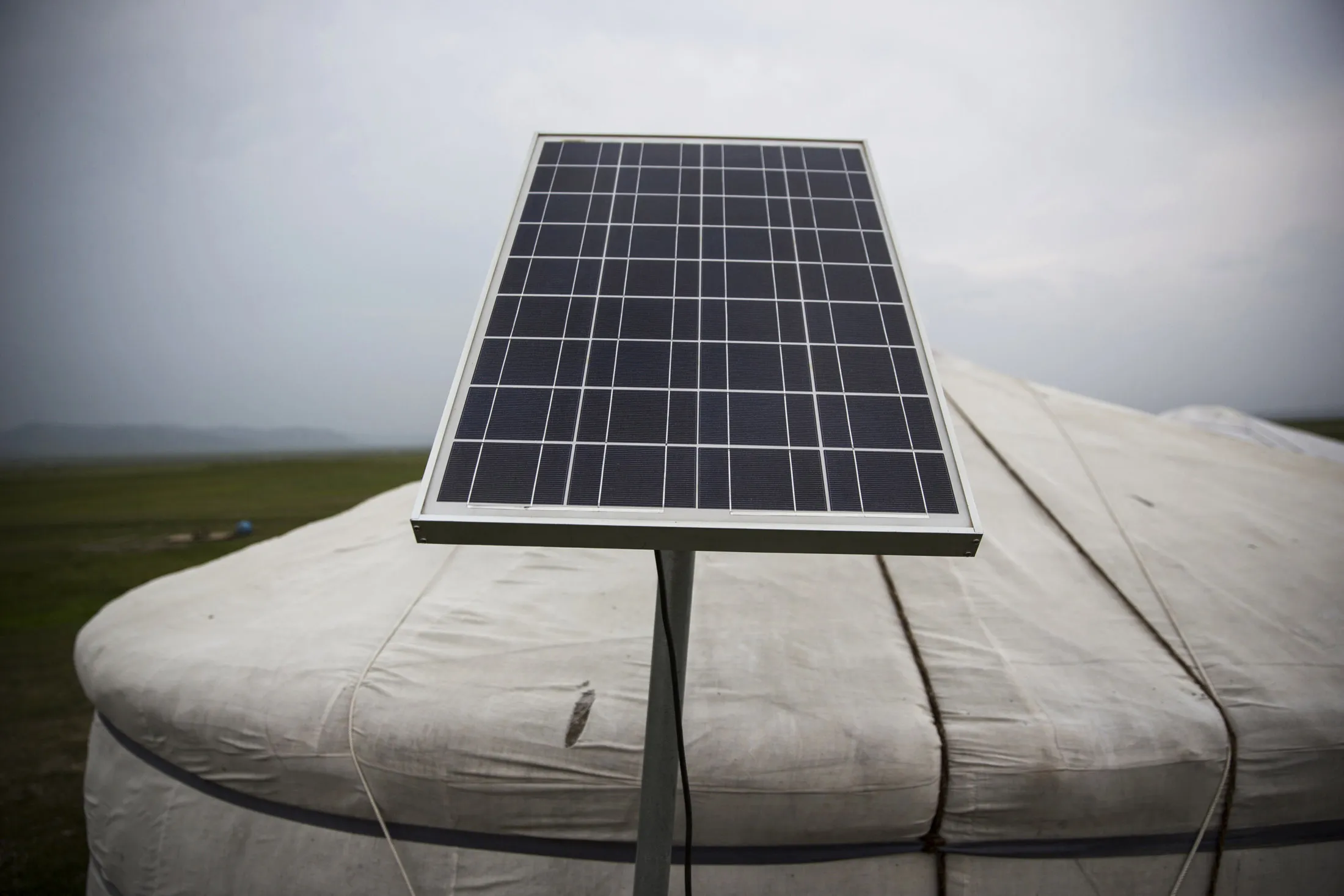A solar unit sits outside a home at a herder family's home who has recently begun accepting guests via Airbnb in Altanbulag, Mongolia on Thursday, July 28, 2016.
