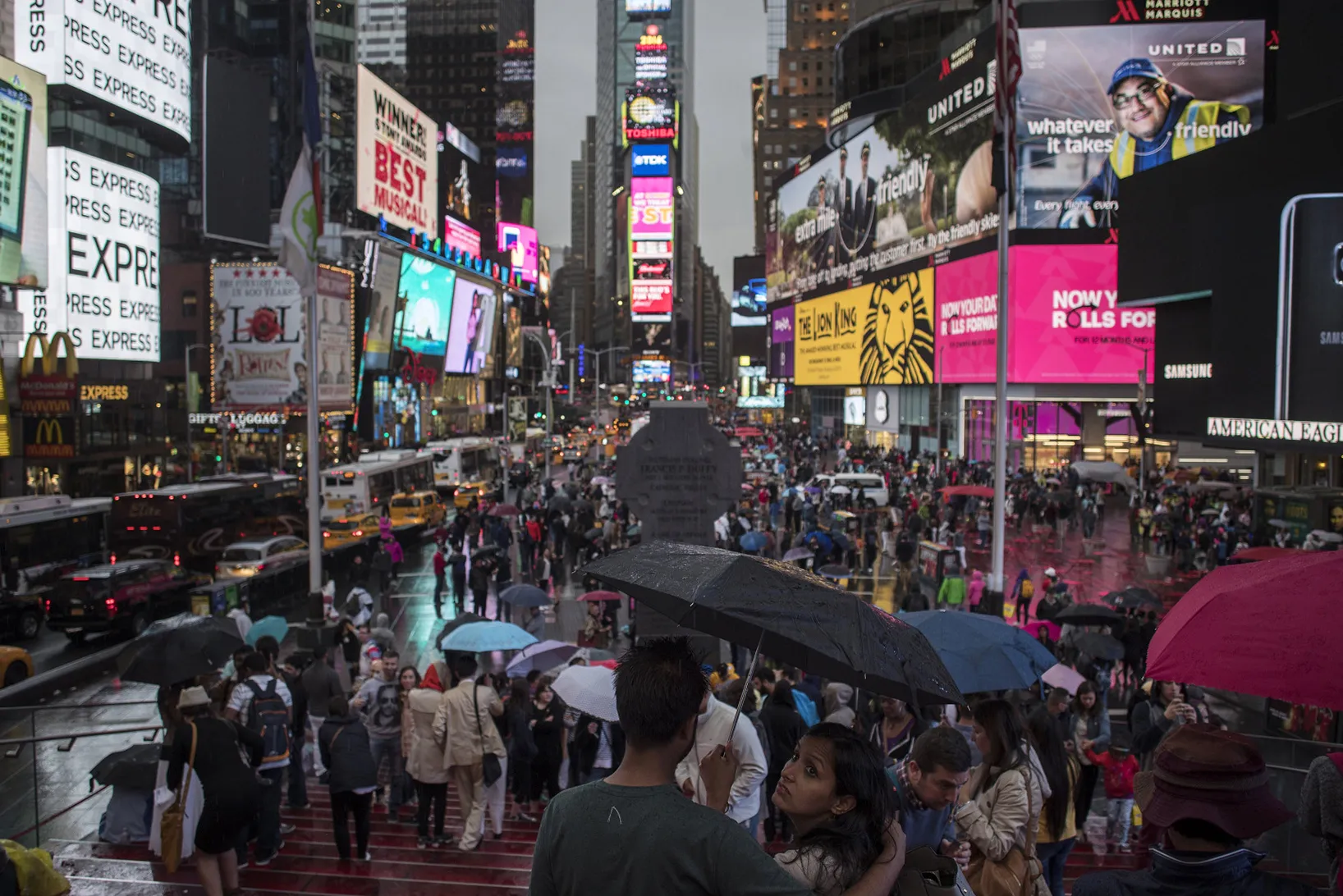 People gather in Times Square in New York.
