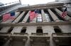 American flags fly outside of the New York Stock Exchange (NYSE) in New York, U.S., on Monday, Oct. 8, 2018. U.S. equities slumped Monday as tech stocks plunged following a testy exchange between Secretary of State Michael Pompeo and Chinese officials during a meeting in Beijing.