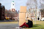 A student moves out of a dorm at Harvard University in Cambridge, Mass., on March 12.