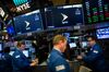 Traders work beneath monitors displaying Sprint Corp. signage on the floor of the New York Stock Exchange (NYSE) in New York, U.S., on Monday, April 30, 2018. Sprint Corp. suffered its worst stock decline in almost six months, rocked by fears that a proposed $26.5 billion takeover by T-Mobile US Inc. will get rejected by antitrust enforcers.