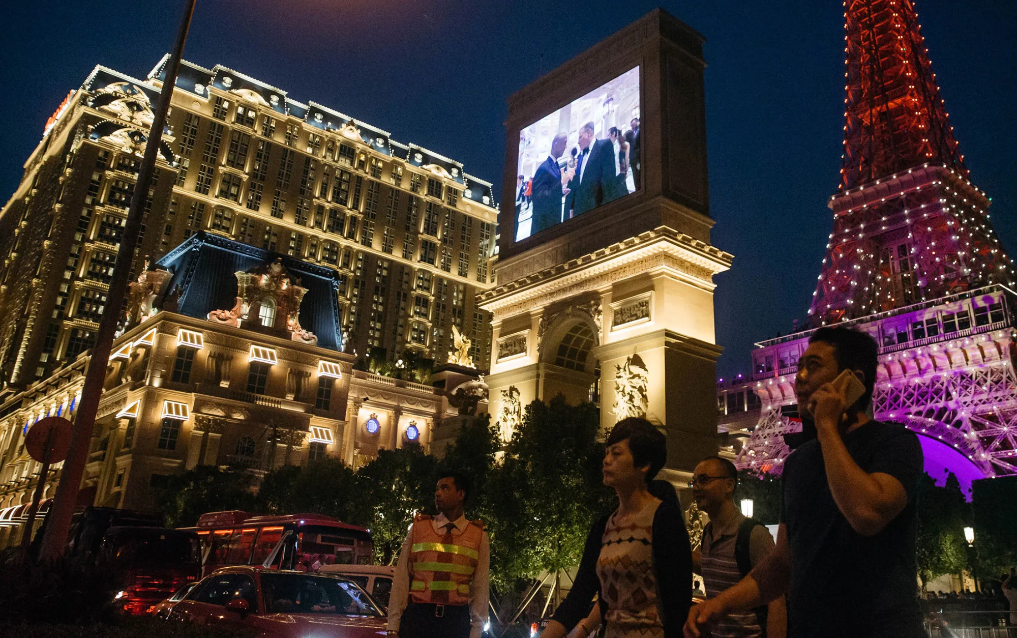 The Eiffel Tower attraction, a half-size replica of the Eiffel Tower in Paris, stands illuminated at the Parisian Macao casino resort in Macau.
