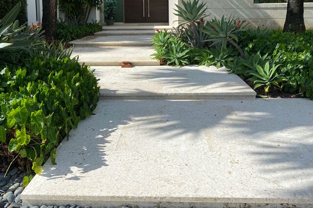 Terraced steps are one of the ways Palm Beach property owners disguise elevation.