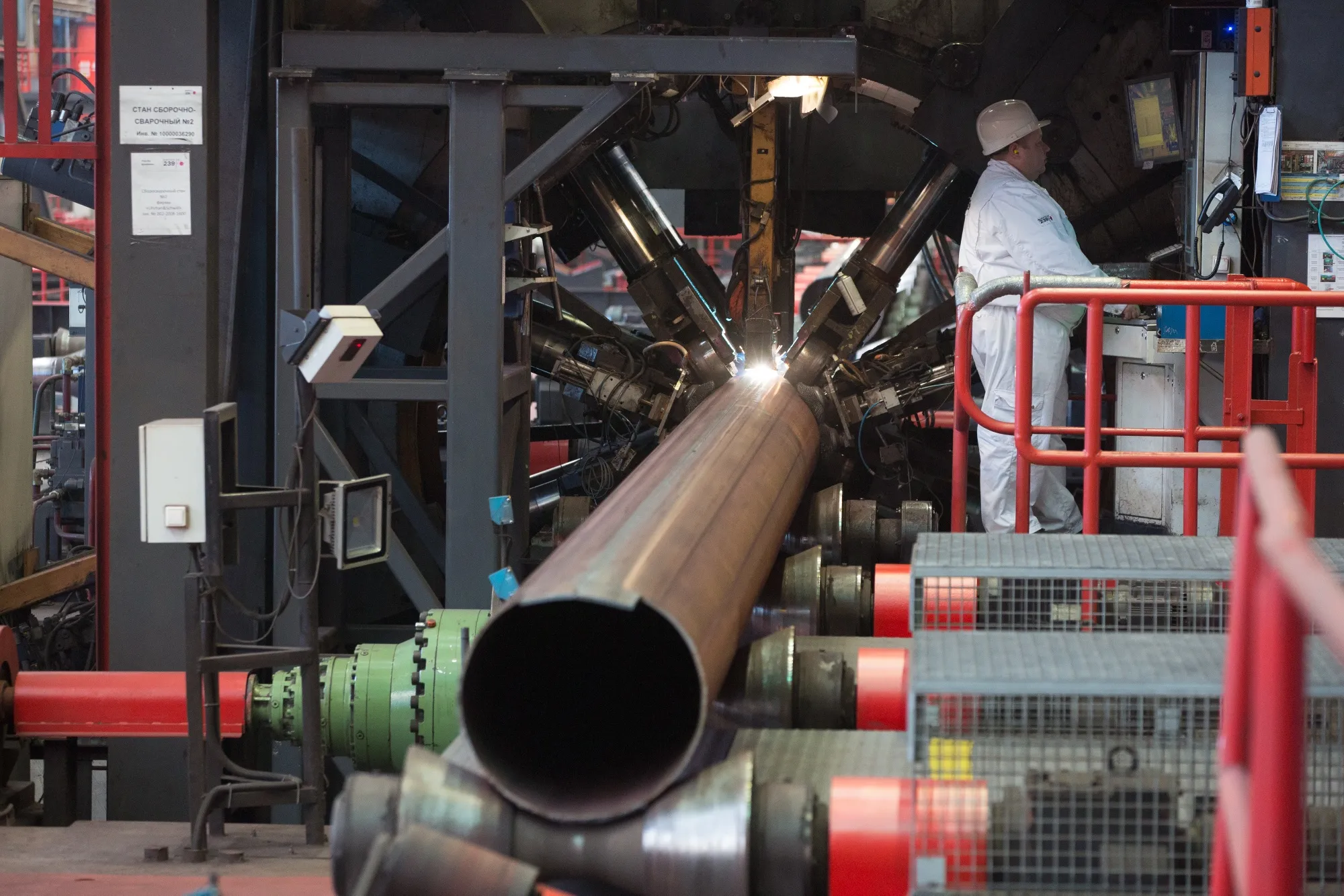A steel pipe is externally welded in a machine at the Chelyabinsk Pipe Rolling Plant PJSC, part of ChelPipe Group, in Chelyabinsk, Russia.