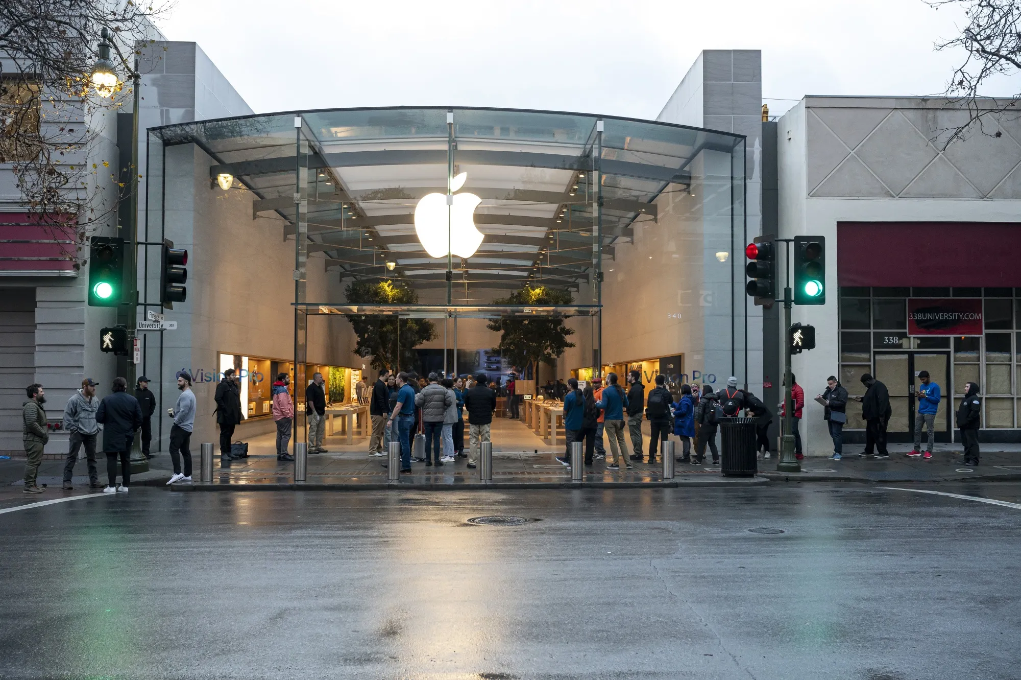 Customers wait in line outside an Apple store in Palo Alto, California.