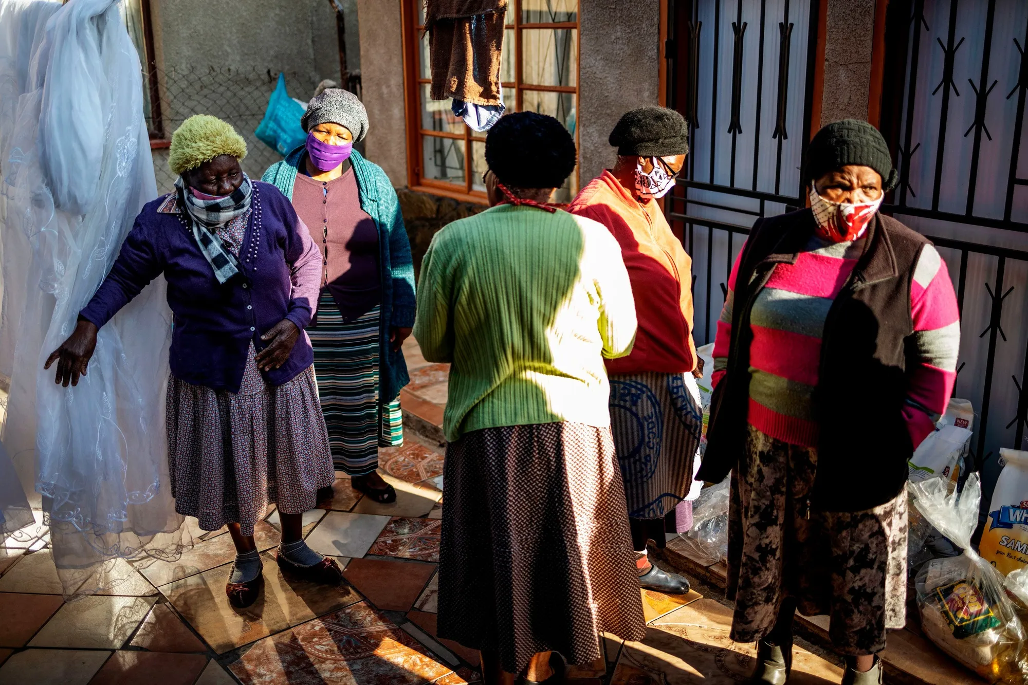 Pensioners check their food parcels distributed by Meals on Wheels in&nbsp;Ekurhuleni, South Africa.
