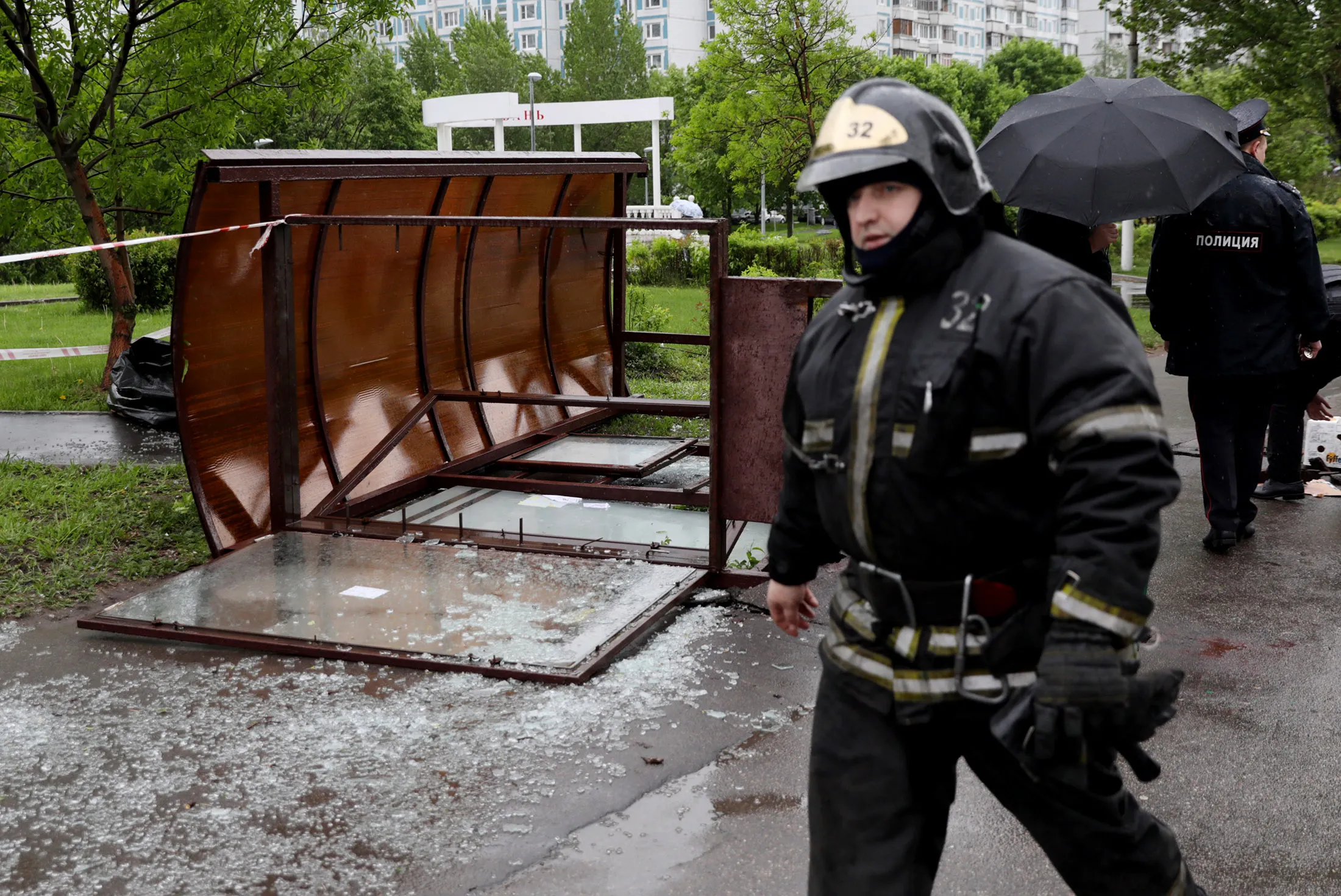 MOSCOW, RUSSIA - MAY 29, 2017: Police officers and emergency workers seen near a fallen bus stop in Moscow's Kirovogradskaya Street. The bus stop has fallen during a heavy storm, killing one person. A yellow alert for a storm and a strong wind has been released. Mikhail Pochuyev/TASS
